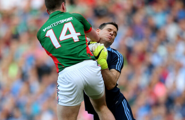 Cillian OÕConnor collides with goalkeeper Stephen Cluxton