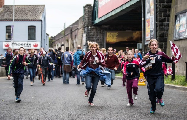 Galway supporters rush towards Hill 16