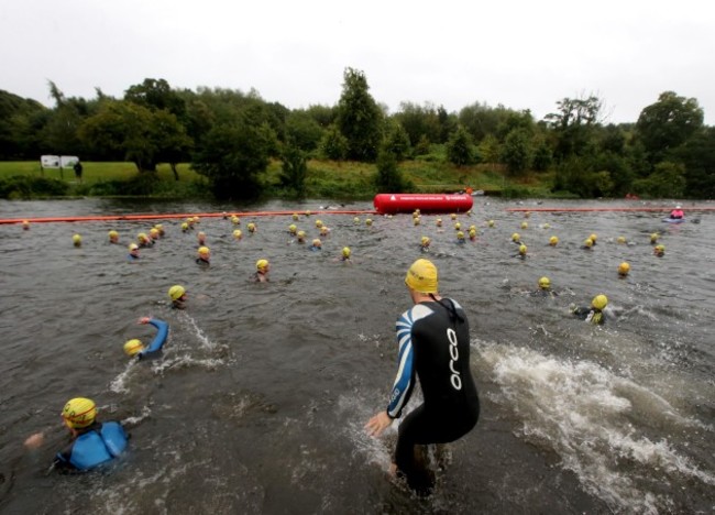 Competitors enter the Liffey