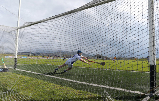 Ciaran Clarke fires an injury time penalty past Enda Rowlan to win the game