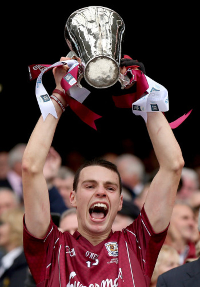 Sean Loftus lifts the trophy