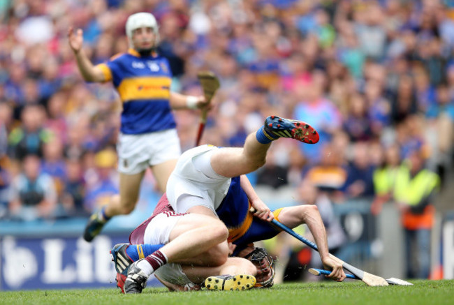 John Hanbury brings down Seamus Callanan