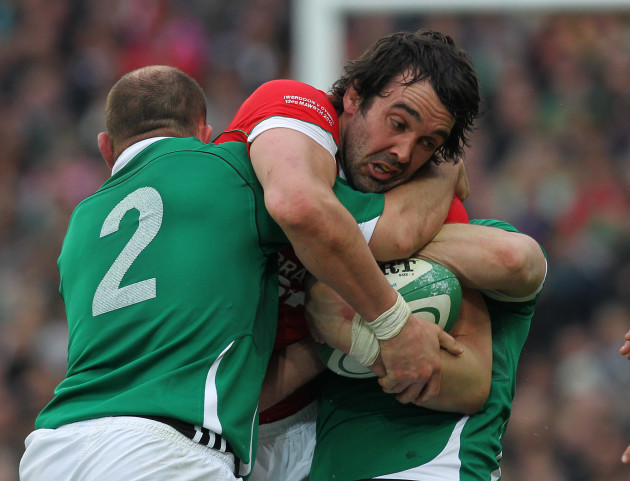 Jonathan Thomas tackled by Rory Best