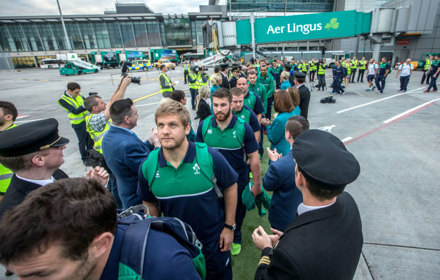 Irish rugby players boarding the Aer Lingus Green Spirit aircraft with Aer Lingus staff forming a guard of honour