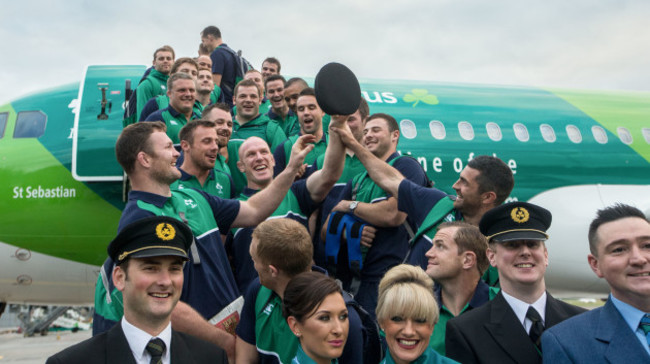 Irish rugby players boarding the Aer Lingus Green Spirit aircraft with Aer Lingus staff forming a guard of honour