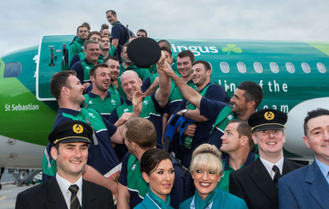 Irish rugby players boarding the Aer Lingus Green Spirit aircraft with Aer Lingus staff forming a guard of honour