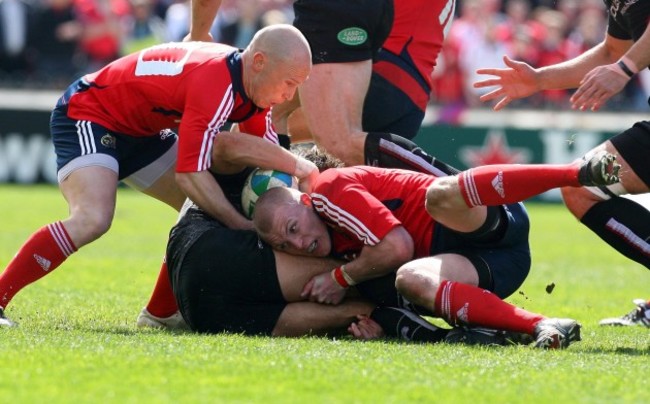 Peter Stringer and Keith Earls make a tackle