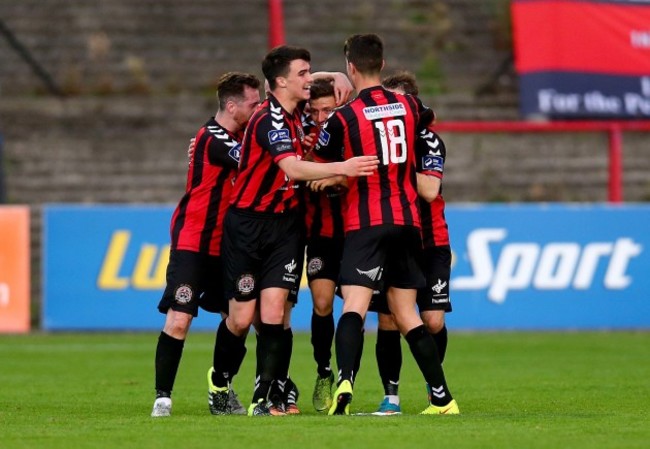 Keith Buckley celebrates scoring the first goal of the game with teammates