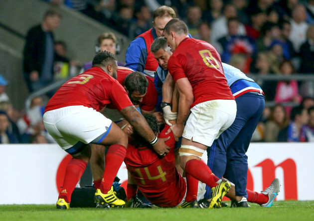 Yoann Huget his helped up by Mathieu Bastareaud, Yoann Maestri  and Louis Picamoles after he got injured