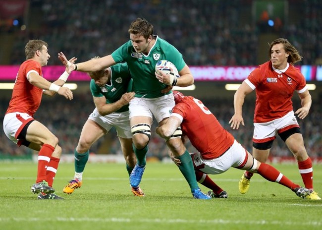 Iain Henderson tackled by Kyle Gilmour