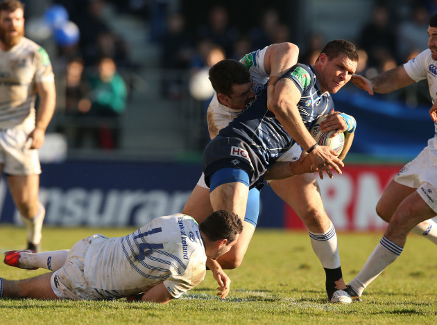 Remi Grosso is tackled by Dave Kearney