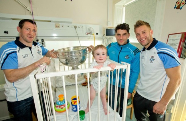 Denis Bastick, Bernard Brogan and Johnny Cooper with the Sam Maguire trophy meet Matthew Carroll-Kiely