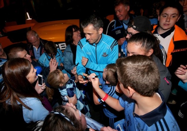 Alan Brogan signs autographs for fans