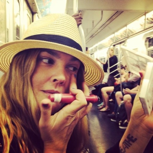 Concealing on the subway! With a @flowerbeauty tester roller ball concealer that comes out January 2015 @walmart #commuterbeauty