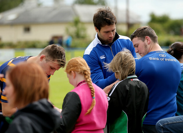 Kevin McLaughlin signs autographs after training