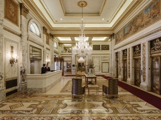 a-gorgeous-lobby-is-just-one-of-the-buildings-amenities-residents-get-all-of-the-benefits-of-living-in-a-hotel-like-cleaning-services-and-access-to-the-spa-fitness-center-hair-salon-and-ballroom