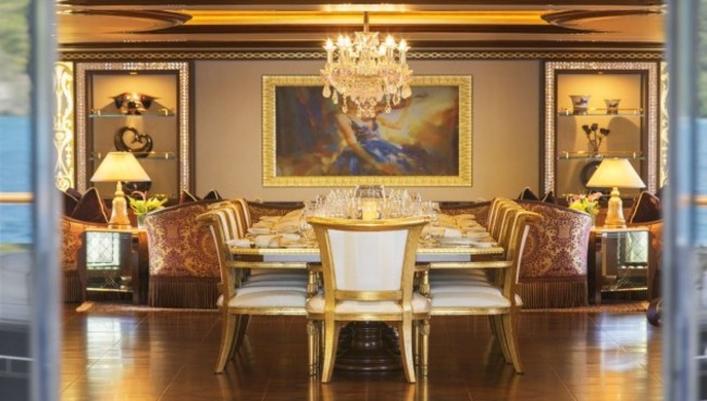 every-aspect-of-the-vessel-is-beautifully-maintained-right-down-to-the-chandelier-that-hangs-over-one-of-the-many-dining-tables-that-can-seat-up-to-12-on-the-far-wall-is-a-painting-an-unusual-fixture-on-any-y