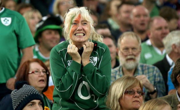 An Irish fans looks on nervously late in the game