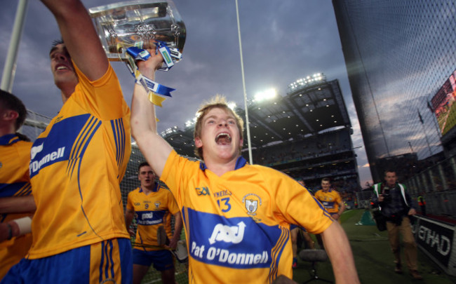 Padraic Collins celebrates with The Liam McCarthy Cup in front of Hill 16