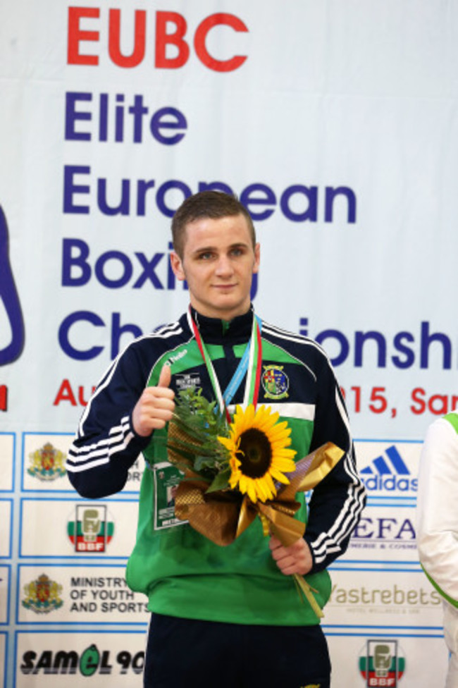 Dean Walsh celebrates with his bronze medal