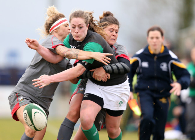 Elise O'Byrne White knocks the ball on