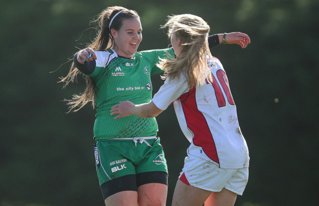 Erin Caughey with Mairead Hopkins at the end of their game