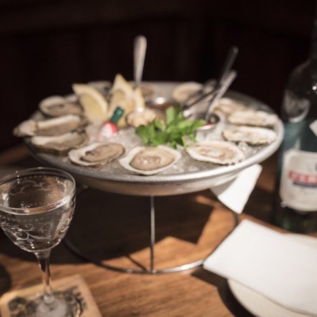 Oysters, Martinis & Absinthe. The Parlor Green Hour runs Monday through Friday from 5pm-7pm with $1 East Coast oysters and specially priced Absinthe laced cocktails.