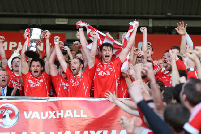 Matthew Donnelly lifts the cup