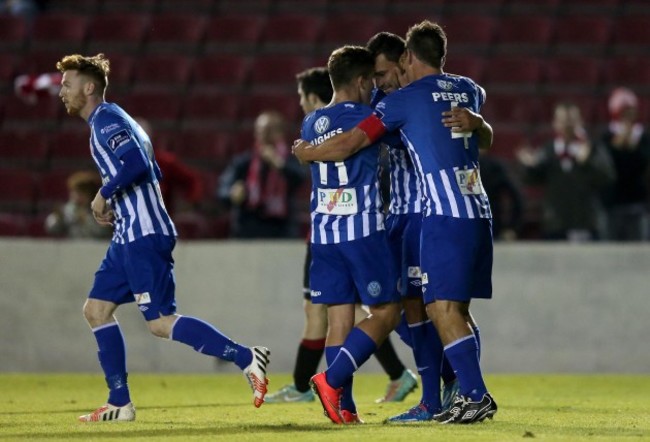 Anthony Elding celebrates with Jason Hughes and Gavin Peers after scoring the equalizing goal