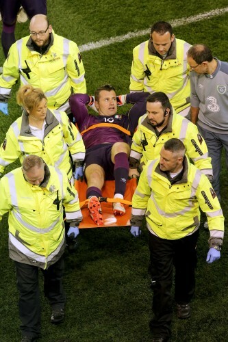 Shay Given is stretchered off as Martin O'Neill has a word with him