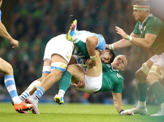 Ian Madigan tackled by Pablo Matera