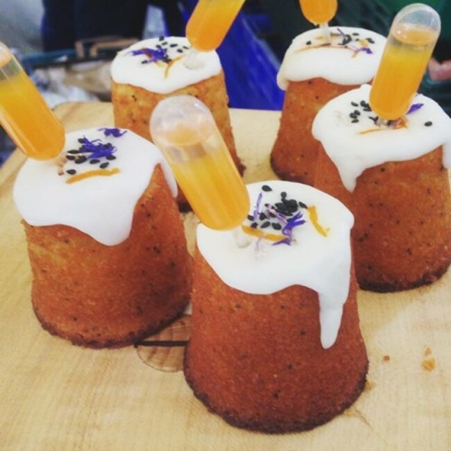 Passion fruit cake with a pipette of saffron gin and passion fruit cocktail.