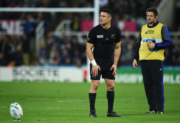 Dan Carter lines up a conversion as Richie McCaw looks on