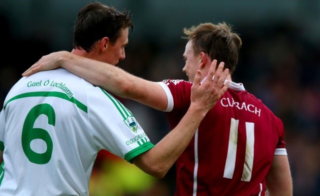 Keith Hogan embraces his brother Brian Hogan at the end of the game