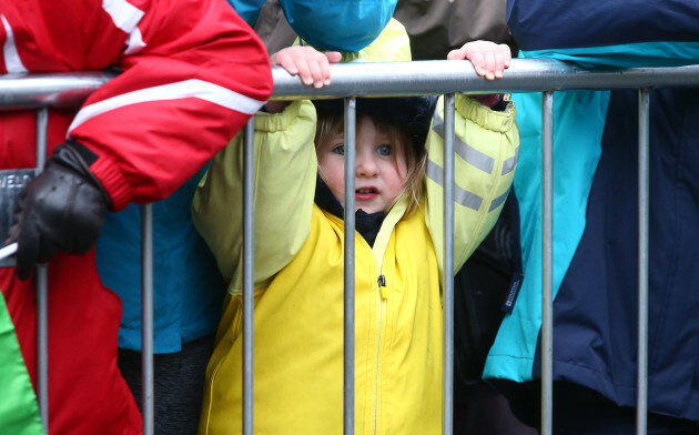 A young spectator watching the action