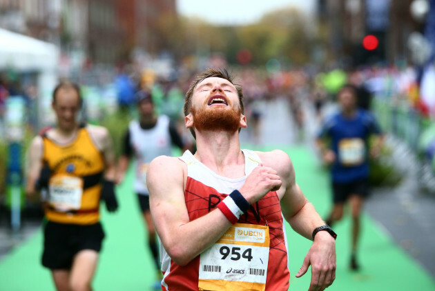 A competitor reacts after crossing the finish line