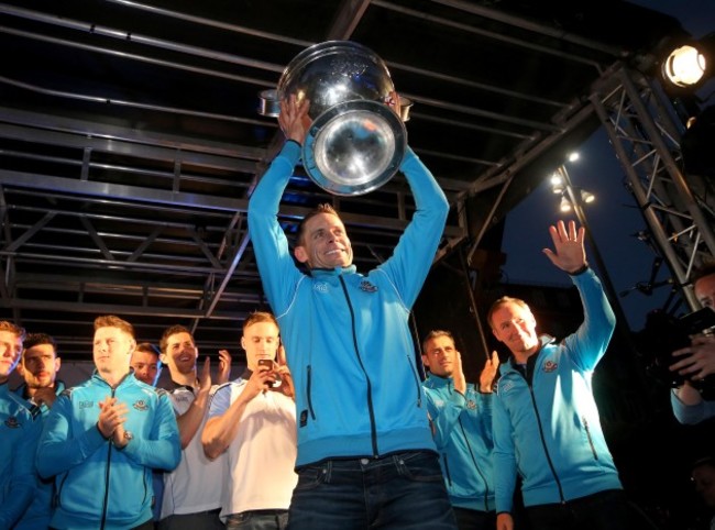 Stephen Cluxton arrives with the Sam Maguire Trophy