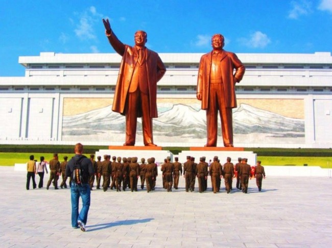 they-also-visited-the-dear-leader-right-and-great-leader-left-statues-in-pyongyang-which-feature-statues-of-kim-jong-il-and-his-father-kim-il-sung-justin-and-anna-were-required-to-bow-before-the-massive-statu