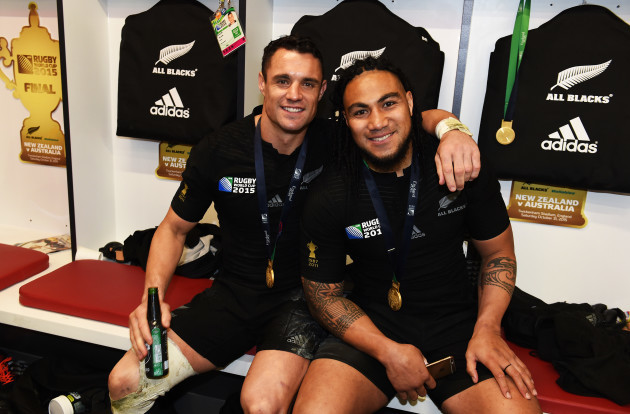 Dan Carter and Ma'a Nonu celebrate in the dressing room after winning