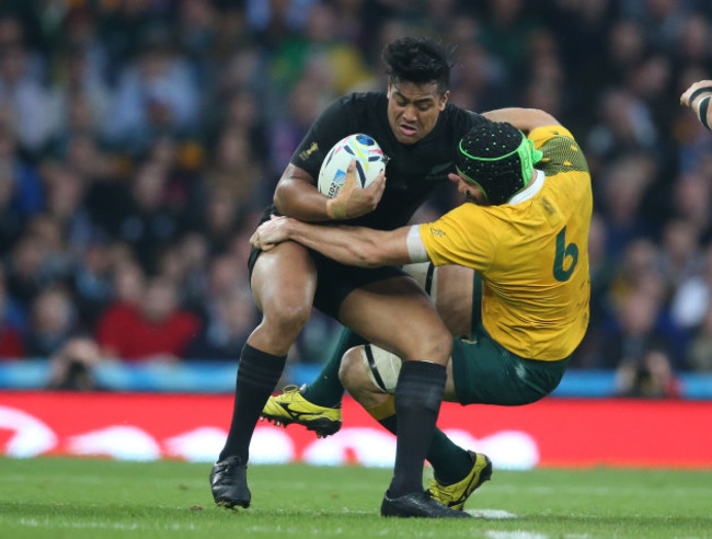 Julian Savea is tackled by Scott Fardy