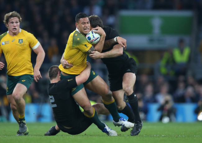 Israel Folau is tackled by Dane Coles and Conrad Smith