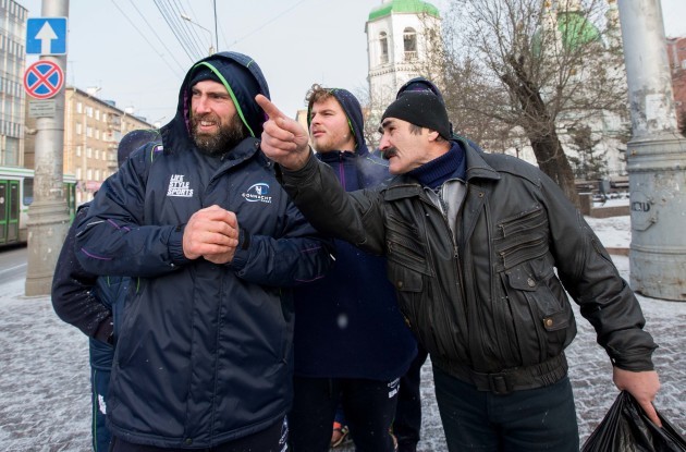 John Muldoon gets directions from a local