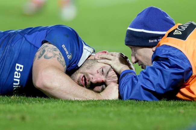 Aaron Dundon down injured after a high tackle with Garreth Farrell