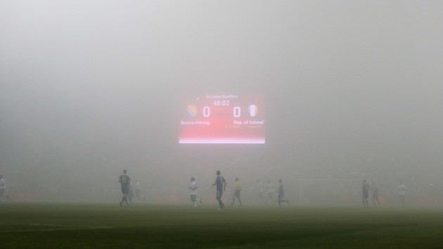 A view of the match as a thick fog covers the pitch