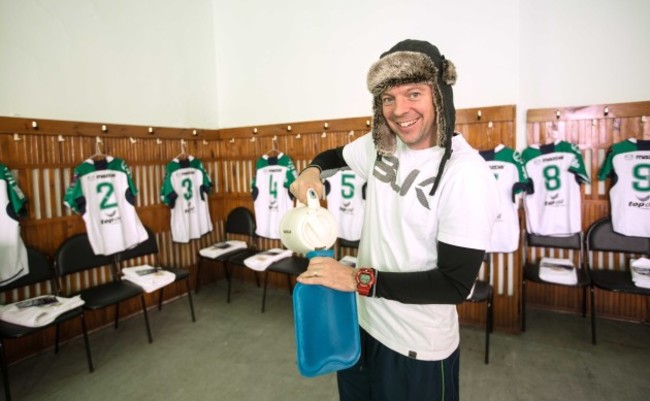 Martin Joyce fills water bottles for the players before the game