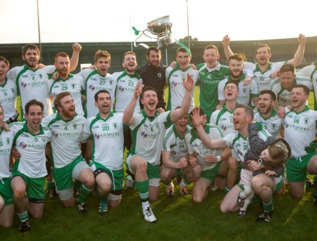 Michael Quinn lifts the trophy