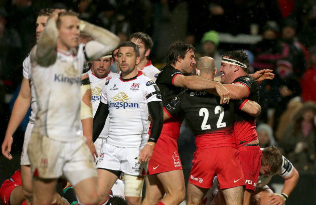 Saracens' players celebrate their last try of the night