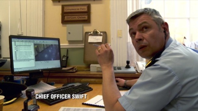 The Joy on TV3 - Ep 3 - In Picture: Chief Officer Swift looking at CCTV footage of prisoner attacking officer with brush