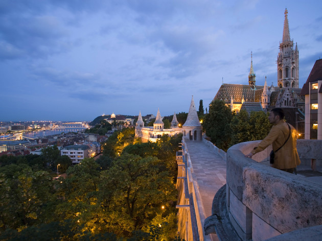 Fishermen's Bastion at Castle Hill, View along Fishermen's Bastion to Matthias Church at Castle Hill at night, Buda, Budapest, Hungary
