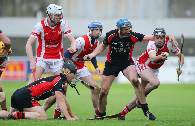 Colum Sheanon is tackled by Garrett Sinnott